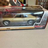 1:18 scale 1969 Pontiac GTO diecast car model in retail box, tan