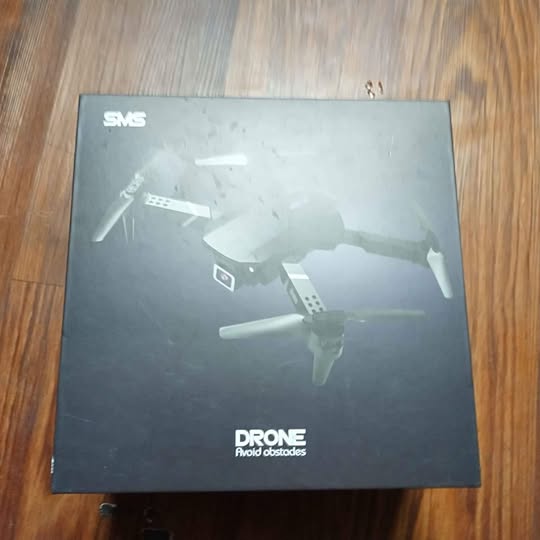 Drone box with quadcopter illustration and camera branding