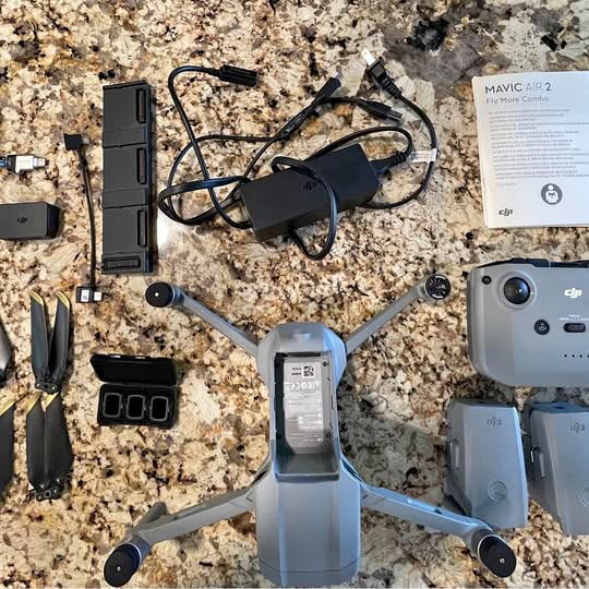 Foldable DJI Mavic Air 2 drone with controller and Fly More charging hub, plus batteries