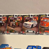 Small diecast car collection, four boxed race cars with vehicle photos and logos