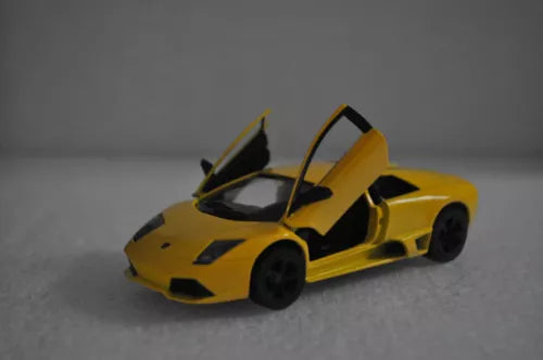 Yellow diecast toy car model, open-top roadster style, 1:36 scale