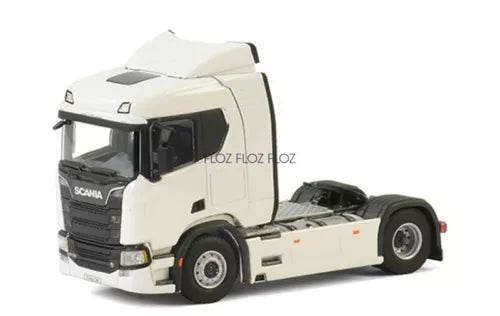 White Scania-style diecast tractor truck model, front three-quarter view.