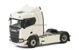 White Scania-style diecast tractor truck model, front three-quarter view.