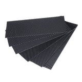 Carbon fiber body panel sheets, dark woven pattern, stacked