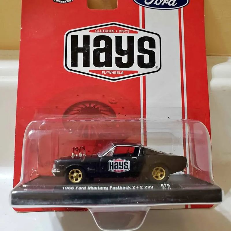 Black 1966 Ford Mustang fastback diecast in clear blister with Hays logo