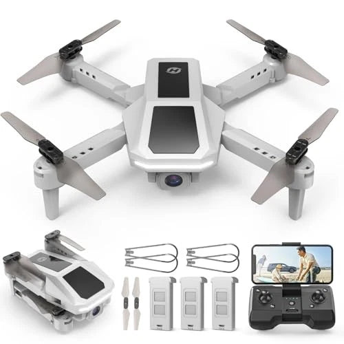 Small white quadcopter drone with camera and four propellers