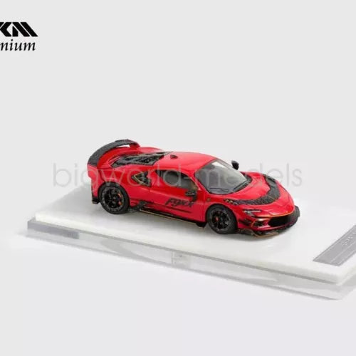 Red racing diecast model sports car with black wheels and hard top