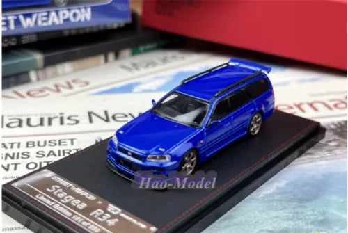 Blue alloy diecast wagon car model on black display base
