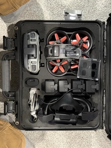 DJI Avata FPV drone in hard case, top view with controller and goggles