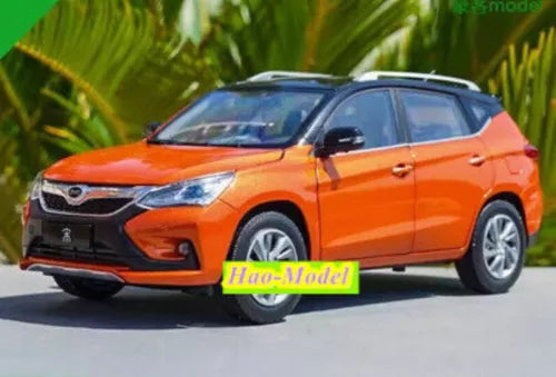 Orange SUV diecast metal model car, front three-quarter view, detailed grille and lights