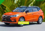 Orange SUV diecast metal model car, front three-quarter view, detailed grille and lights