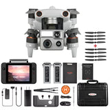 White quadcopter drone with front camera, four rotors, and accessory kit.
