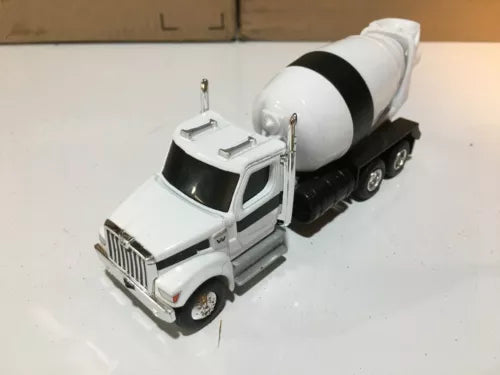White cement mixer diecast truck with rotating drum and black chassis, tandem axles