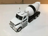 White cement mixer diecast truck with rotating drum and black chassis, tandem axles