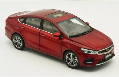 Red 1/18 scale diecast sedan car model, front three-quarter view.