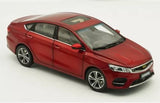 Red 1/18 scale diecast sedan car model, front three-quarter view.
