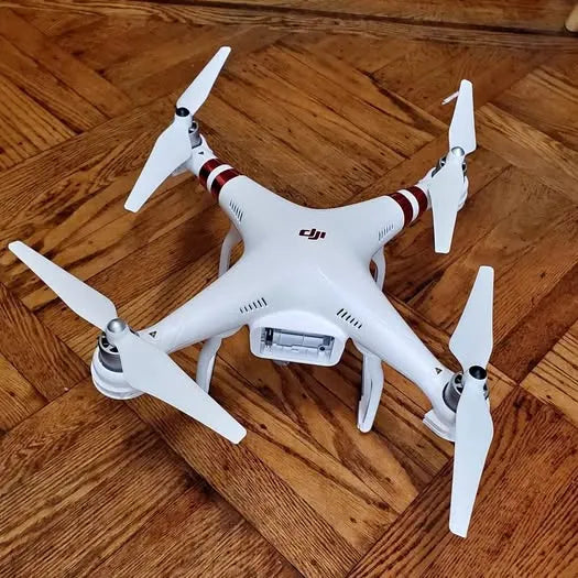 DJI Phantom 3 drone, white quadcopter with four propellers and mounted camera