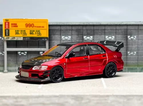 Red diecast sports sedan toy car with black wheels and hood detail