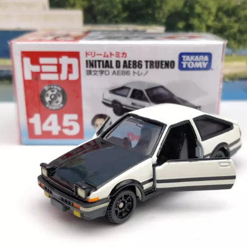 Takara Tomy diecast car model, white and black two-door AE86, front 3/4 view