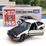 Takara Tomy diecast car model, white and black two-door AE86, front 3/4 view