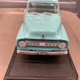 Light blue 1953 Ford F-100 pickup toy truck, diecast model, front grille view