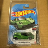 Hot Wheels diecast roadster in clear blister, green with black wheels