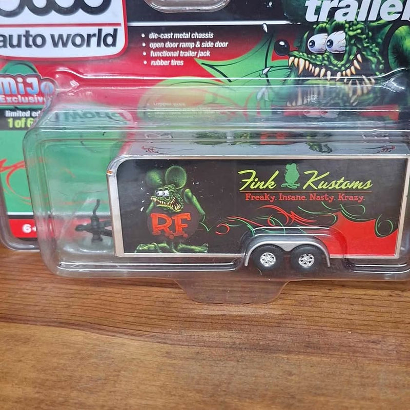 Diecast trailer toy in clear blister, red and green monster art, two-axle trailer
