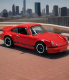 Red 1973 Porsche 911 Carrera RS 2.7 diecast toy car, front three-quarter view, 1:64 scale