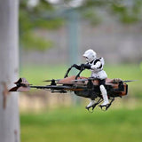 Star Wars speeder drone with pilot figure, black and tan quadcopter with rotors