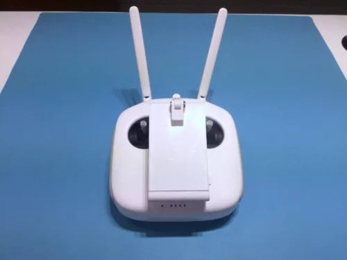 DJI Phantom 4 Pro remote controller with two white antennas, central screen mount