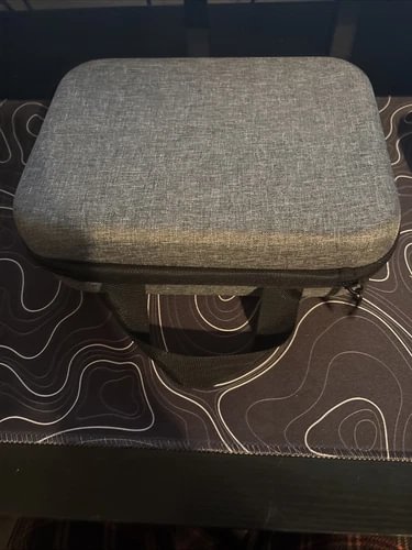 Gray padded rectangular carrying case with hinged lid