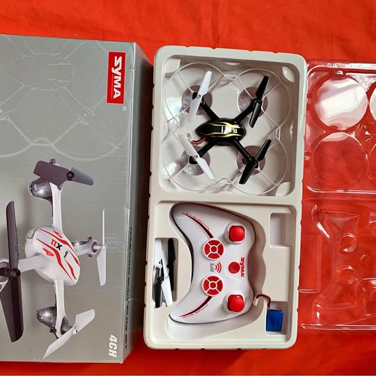 Edgewater FL quadcopter drone in retail box, propellers and controller visible