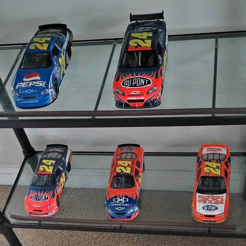Set of four diecast race cars, red, blue and black, with car number 21
