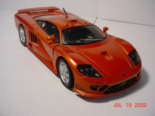 Orange Saleen diecast model car, front 3/4 view with black hood accents