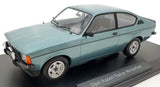 Turquoise 1/18 diecast rally car model, front three-quarter view on display base