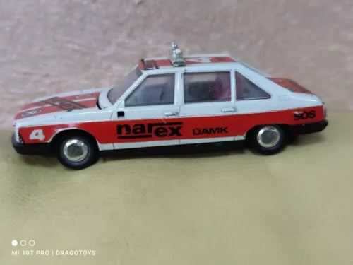 Vintage toy car Tatra 623 in red and white with narex logo, side view