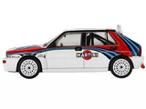 White Martini-style Lancia Delta HF Integrale diecast model car with red and blue stripes