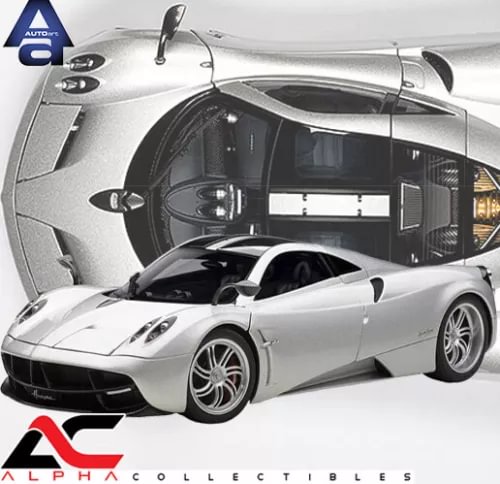 Silver 1:18 scale supercar diecast model with front open cockpit and detailed wheels