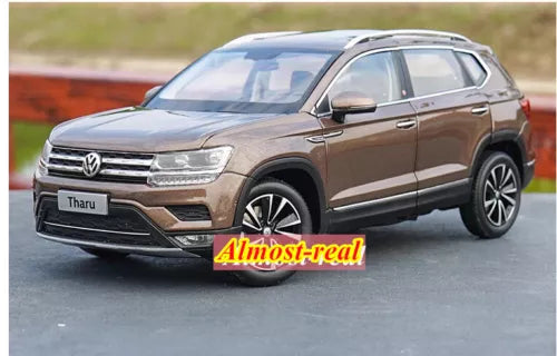 Brown Volkswagen Tharu diecast SUV model car, front 3/4 view with chrome grille