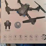 Foldable GPS drone with four propellers and front camera module