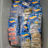 Assorted Hot Wheels diecast cars in blue blister packs, various styles