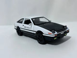 White and black 1/36 Toyota AE86 model car diecast, front 3/4 view