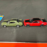 SRT Challenger diecast cars, red and light green, side by side