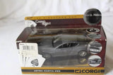 Diecast toy car model in retail box, dark gray Aston Martin DBS