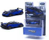 Blue 1:64 diecast model car with black accents, open box packaging.