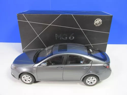 Diecast MG 6 1:16 scale model car in grey-silver, boxed