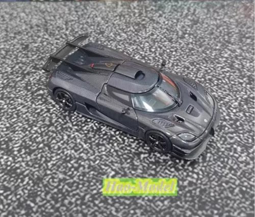 Black alloy diecast sports car model ornament, front 3/4 view with open details