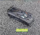 Black alloy diecast sports car model ornament, front 3/4 view with open details