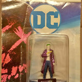 Joker diecast figure in blister pack, standing with purple coat and green hair
