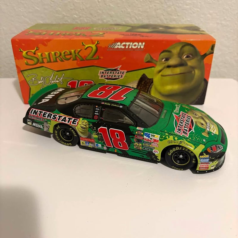 Diecast race car, green and black with #18 and Shrek 2 branding in box
